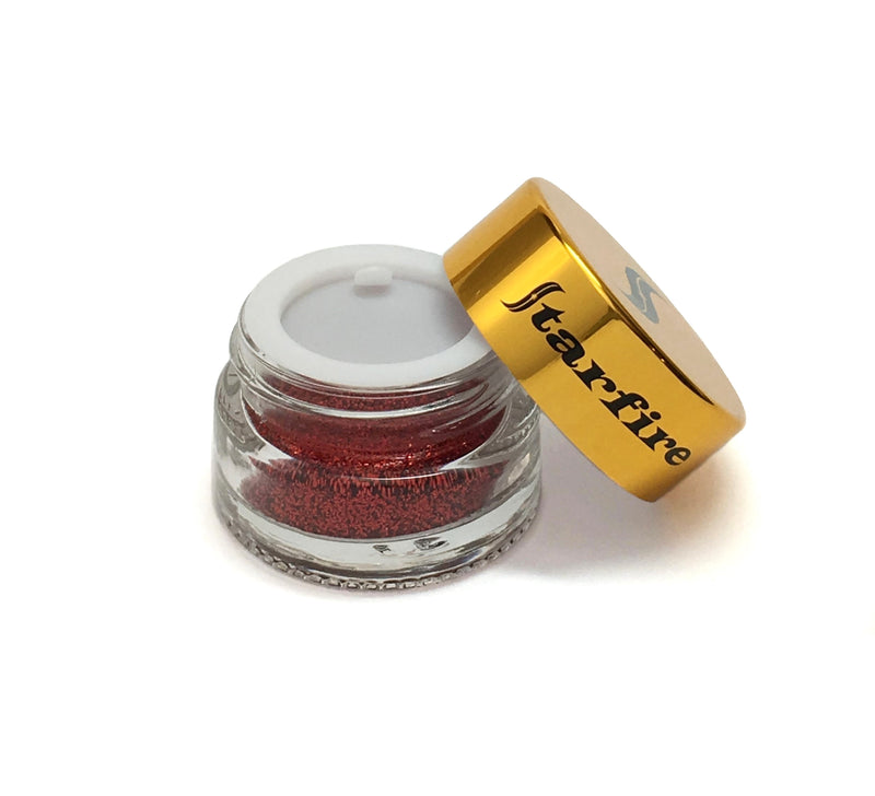red glitter inside glass jar open with gold lid-starfire cosmetics