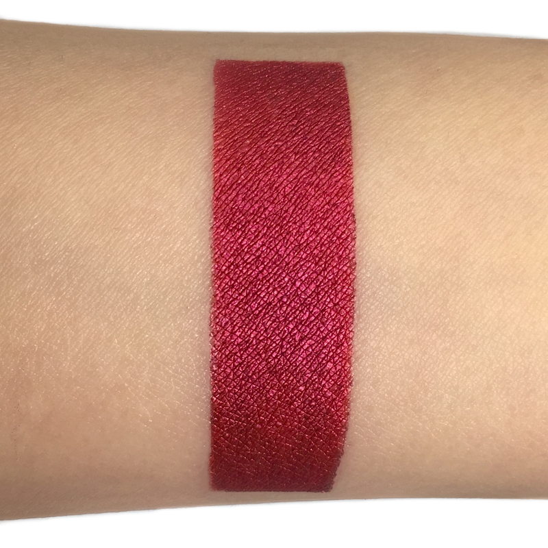red metallic liquid lipstick on arm-starfire cosmetics