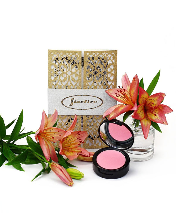 pink blush in black case next to flowers and starfire card-starfire cosmetics