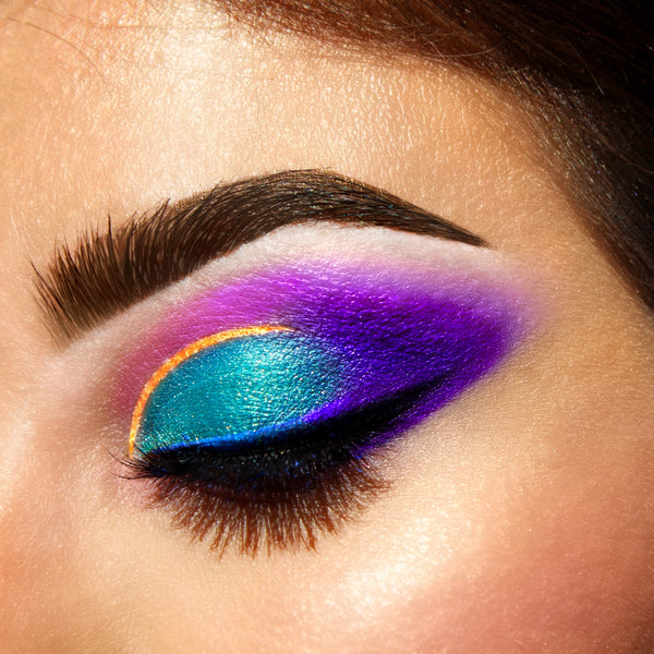 vibrant gold, green, purple eyeshadow on woman's eyes-starfire cosmetics