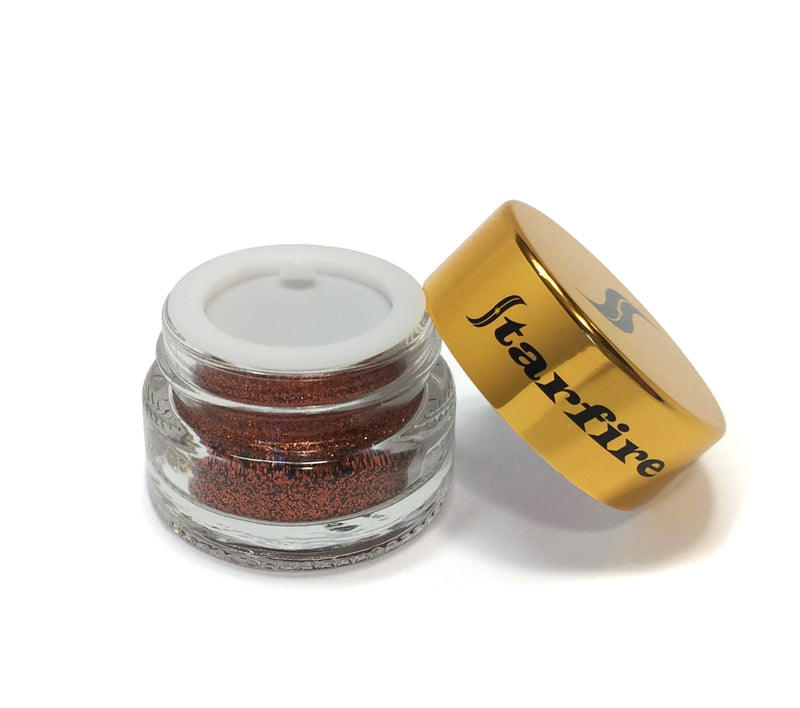 copper glitter inside glass jar with gold lid open-starfire cosmetics