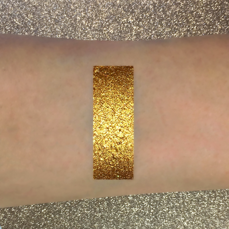 gold eyeshadow pigment on arm-starfire cosmetics