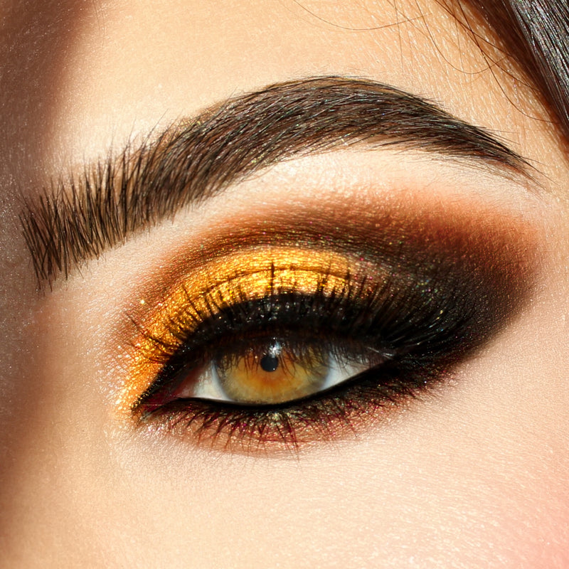 women eyes opened wearing gold eyeshadow-starfire cosmetics