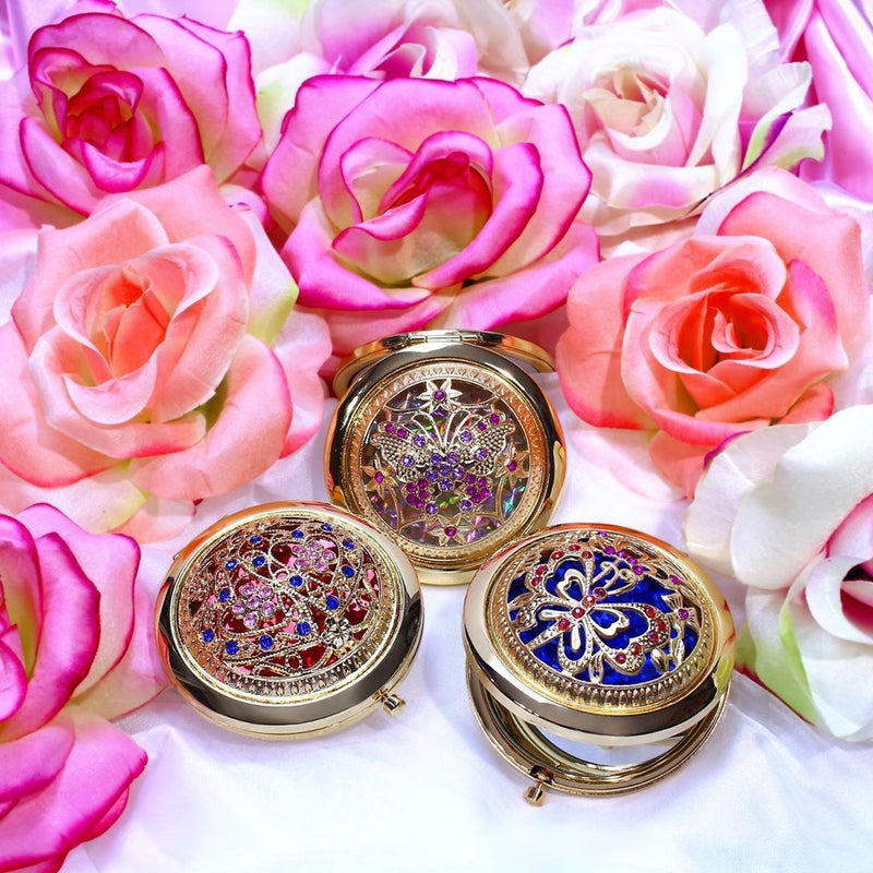 3 makeup mirrors red, blue, and white next to pink flowers-starfire cosmetics